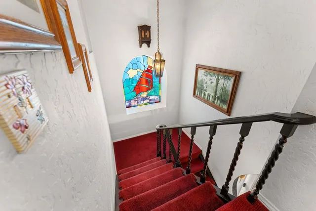 a kitchen with stainless steel appliances kitchen island granite countertop a sink and cabinets