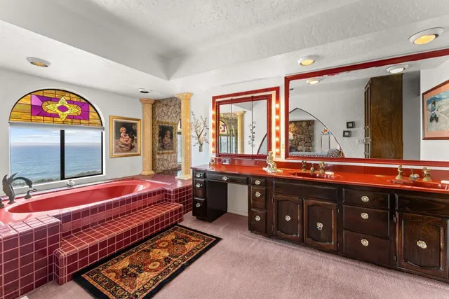 a view of a livingroom with furniture and a flat screen tv