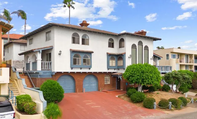 a view of a patio with table and chairs with wooden floor and plants