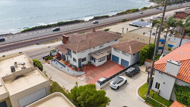 a view of a house with a sink and fire pit