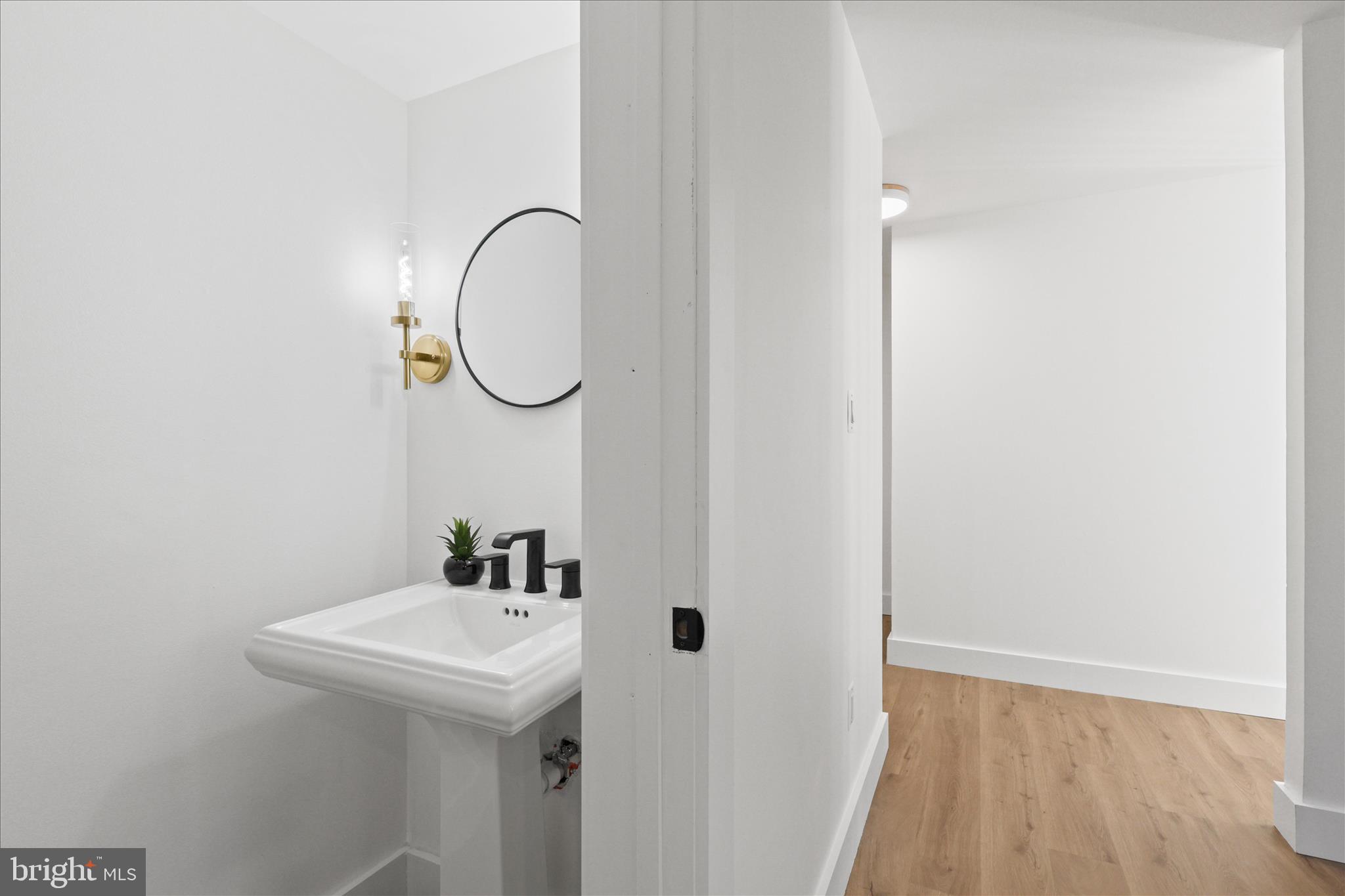 11152 Forest Edge Drive Reston, VA 20190 - Photo 11 of 57 a bathroom with a sink and a mirror