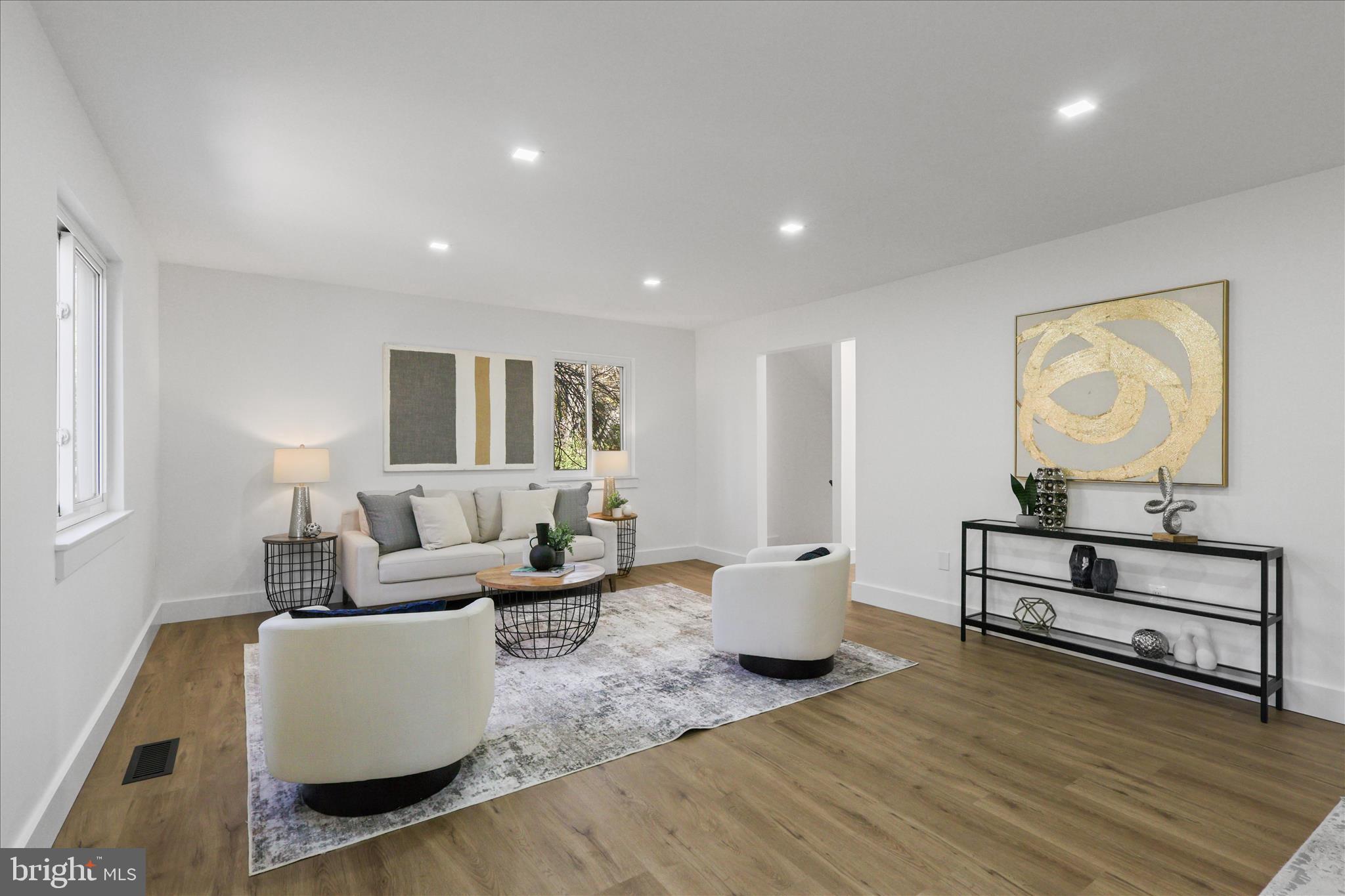 11152 Forest Edge Drive Reston, VA 20190 - Photo 14 of 57 a living room with furniture and a wooden floor