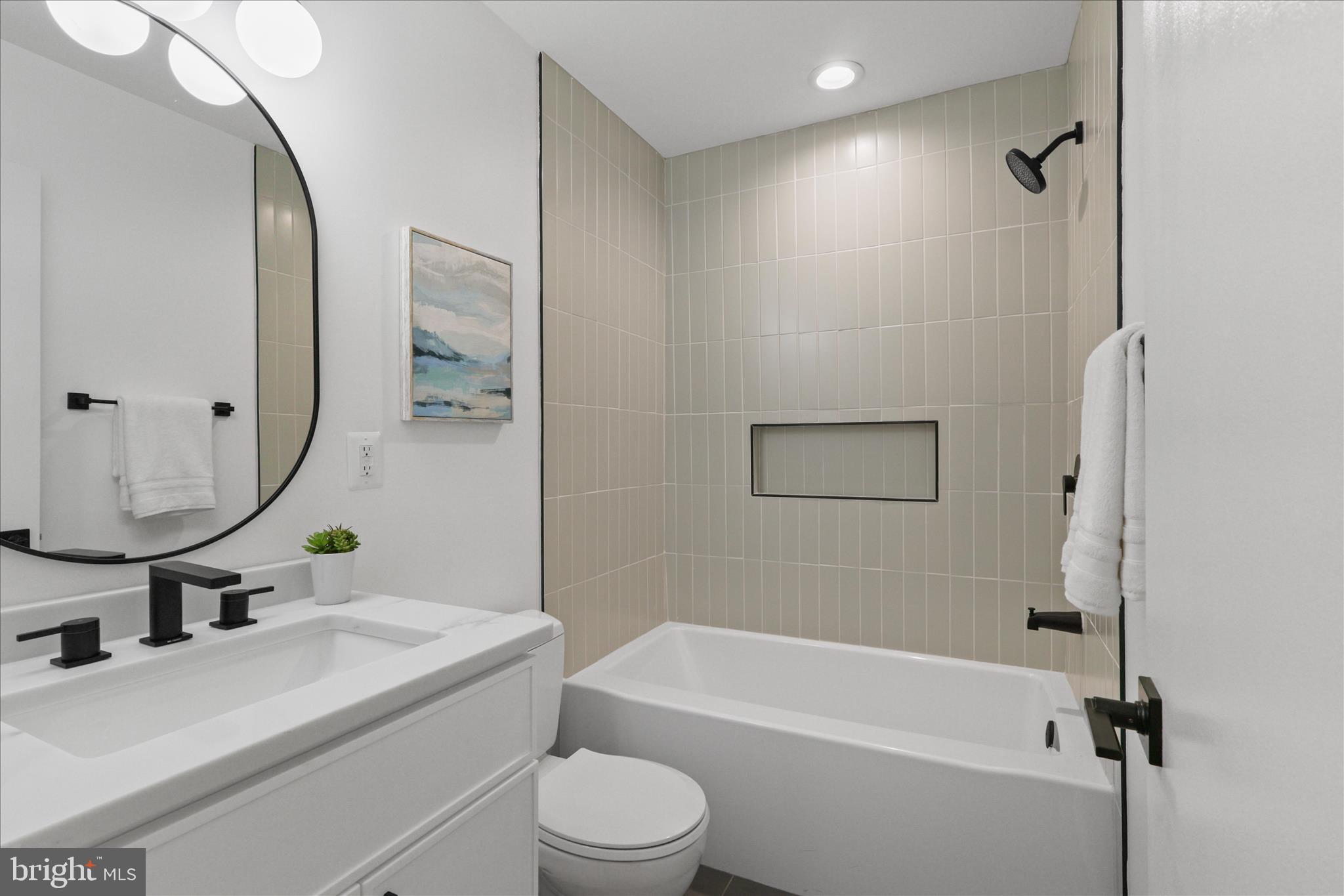 11152 Forest Edge Drive Reston, VA 20190 - Photo 25 of 57 a bathroom with a sink a toilet and shower