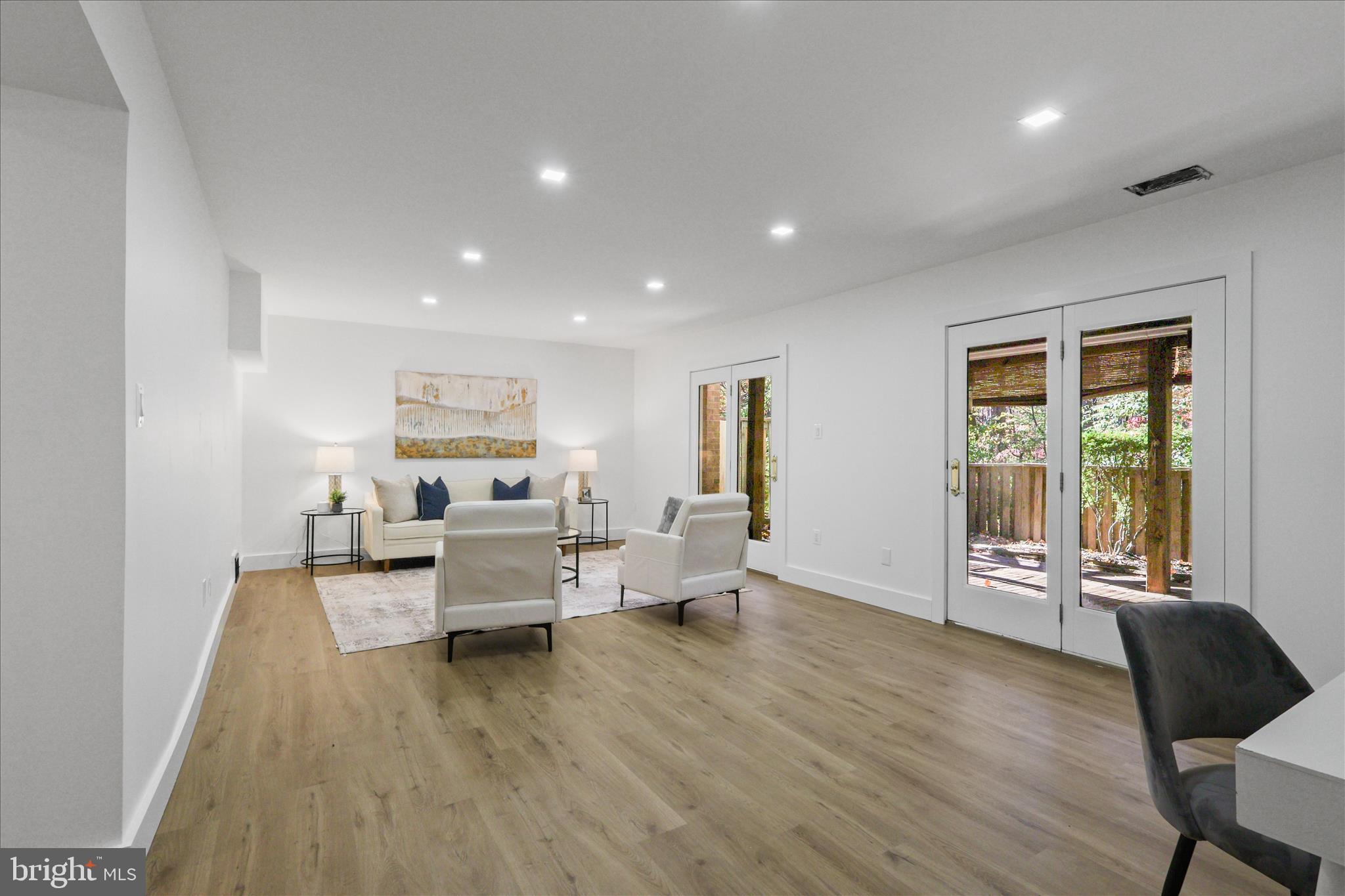 11152 Forest Edge Drive Reston, VA 20190 - Photo 29 of 57 a living room with furniture and a wooden floor