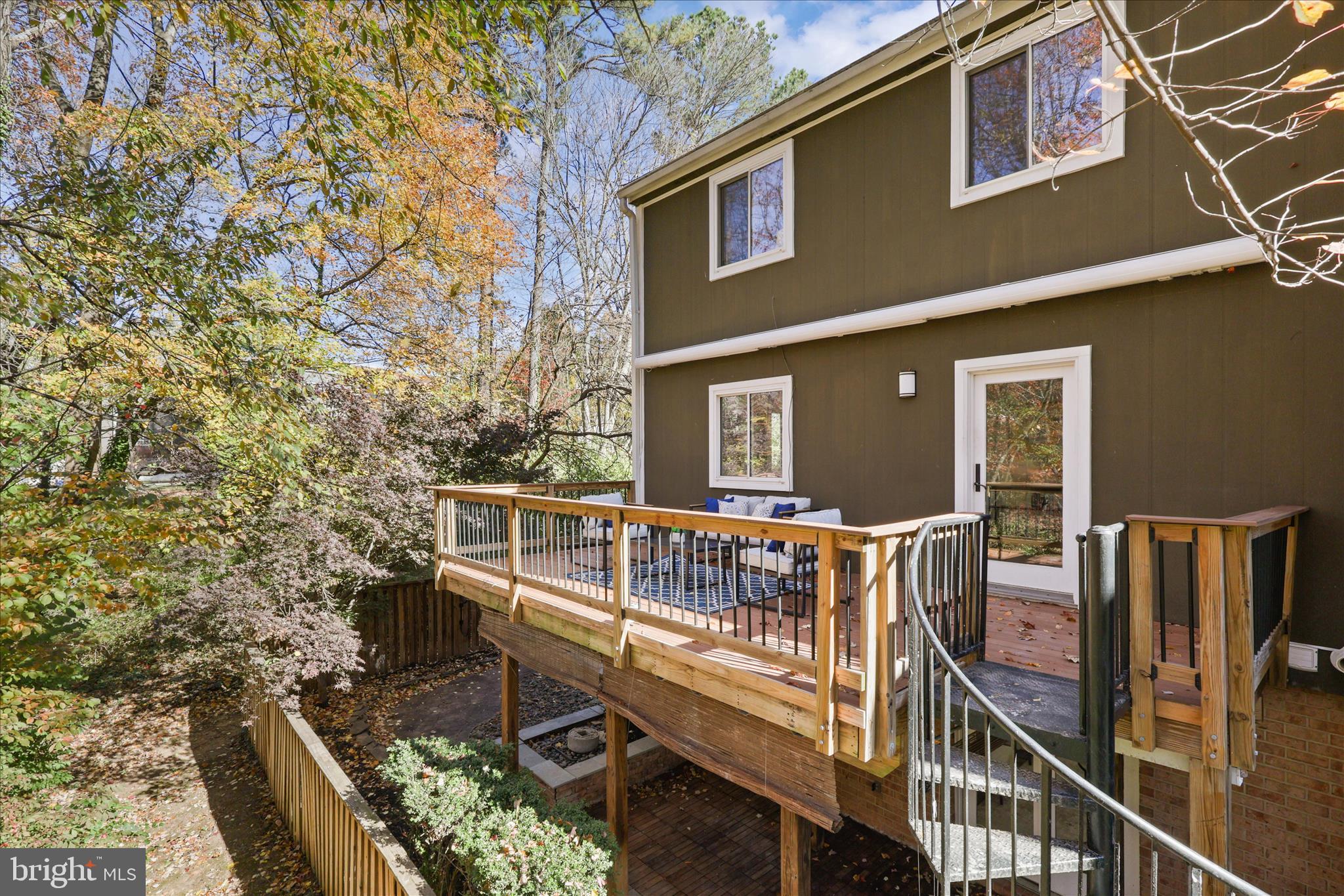 11152 Forest Edge Drive Reston, VA 20190 - Photo 34 of 57 a balcony with chairs and wooden fence