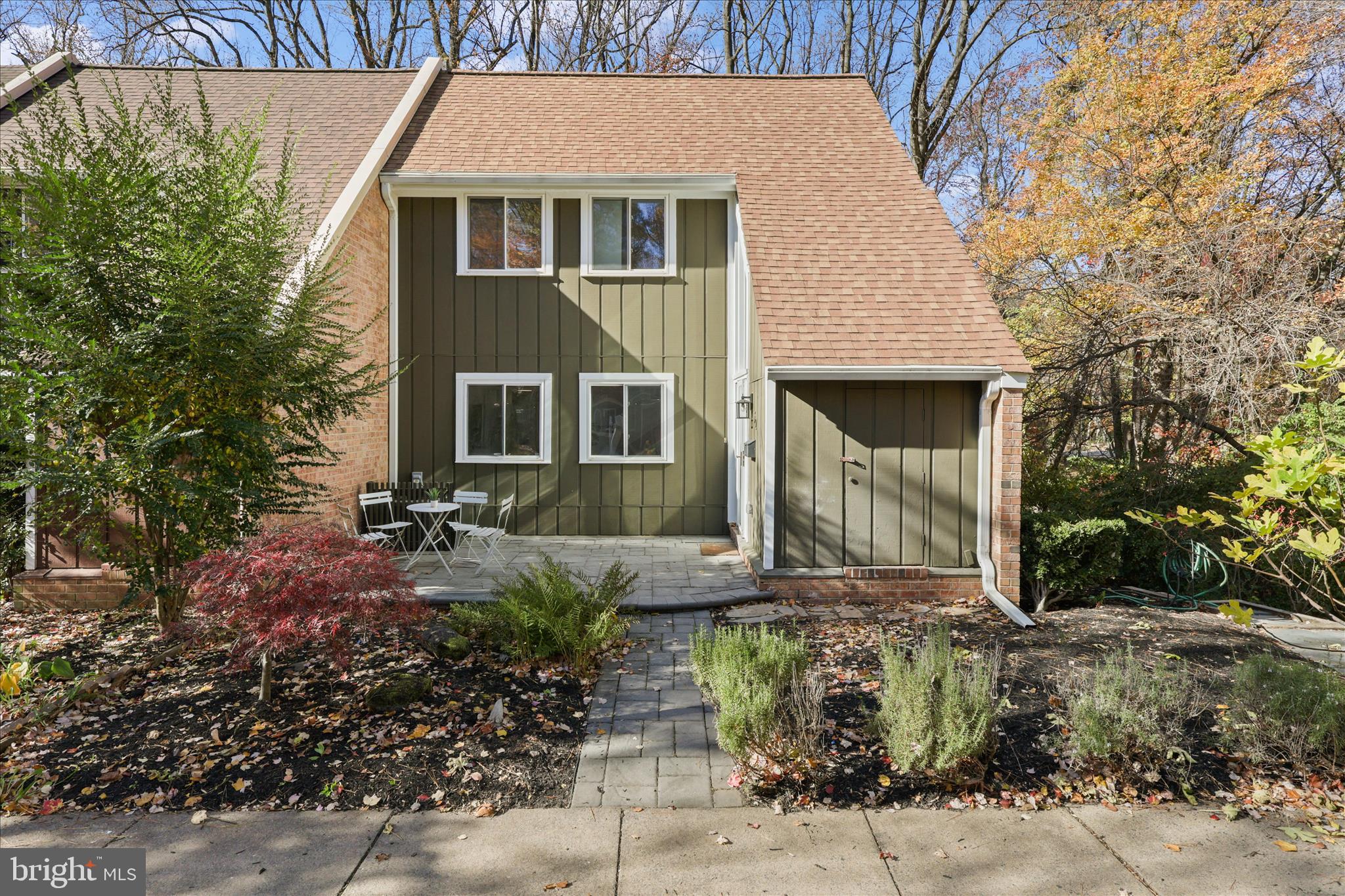 11152 Forest Edge Drive Reston, VA 20190 - Photo 36 of 57 a front view of a house with garden