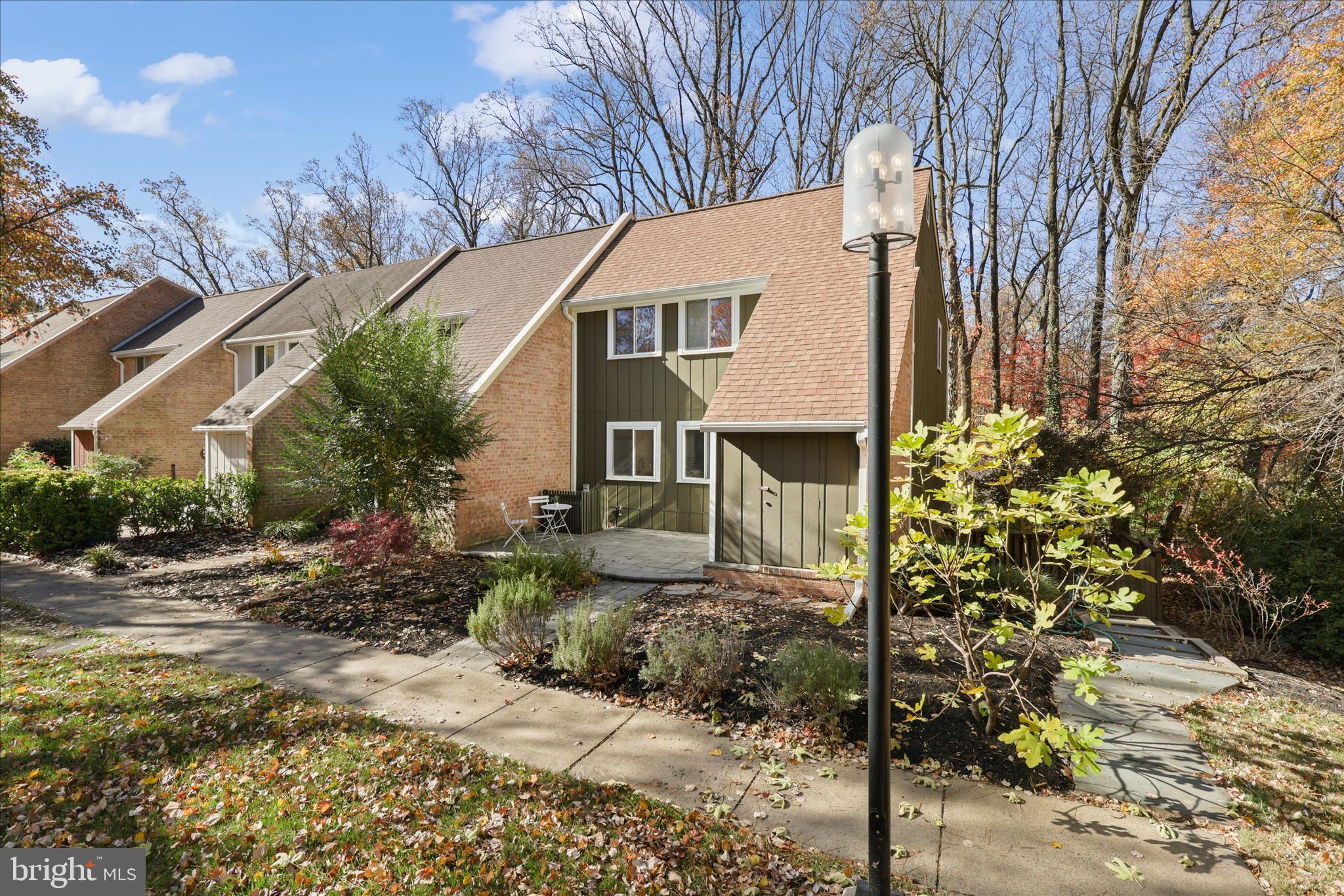 11152 Forest Edge Drive Reston, VA 20190 - Photo 37 of 57 a front view of a house with garden