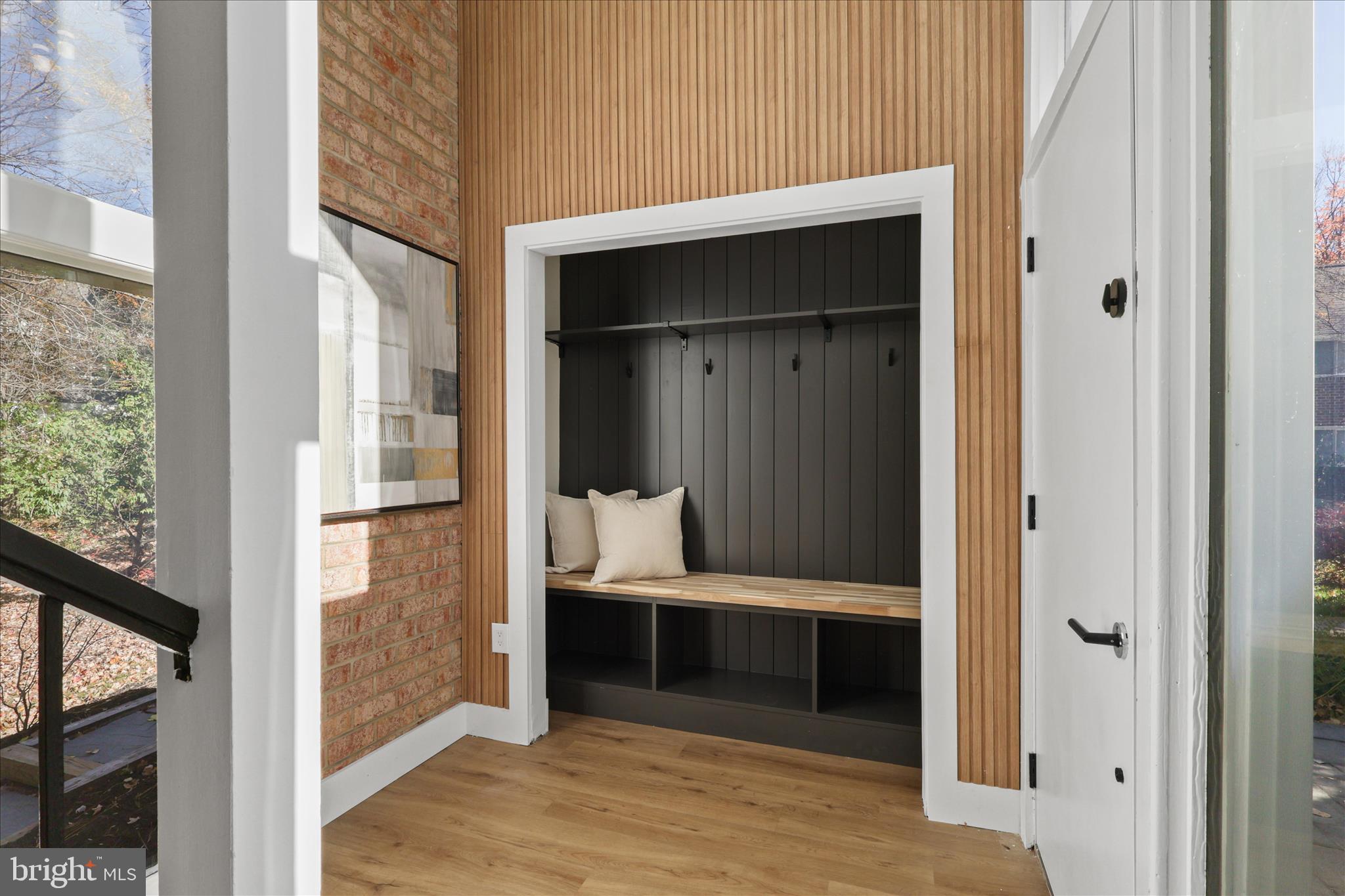 11152 Forest Edge Drive Reston, VA 20190 - Photo 4 of 57 a hallway with two couches and a fireplace