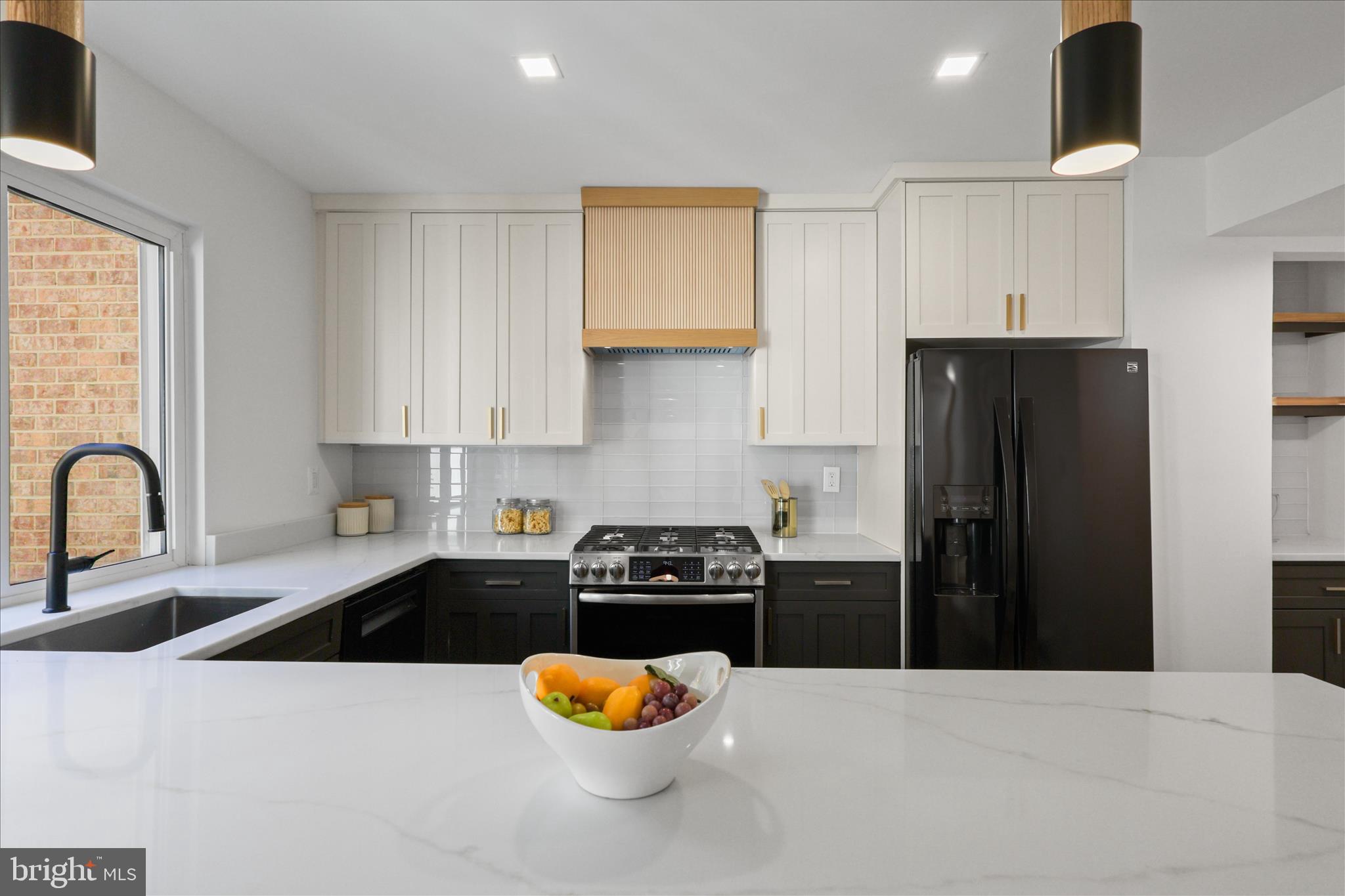 11152 Forest Edge Drive Reston, VA 20190 - Photo 6 of 57 a kitchen with a refrigerator and a sink