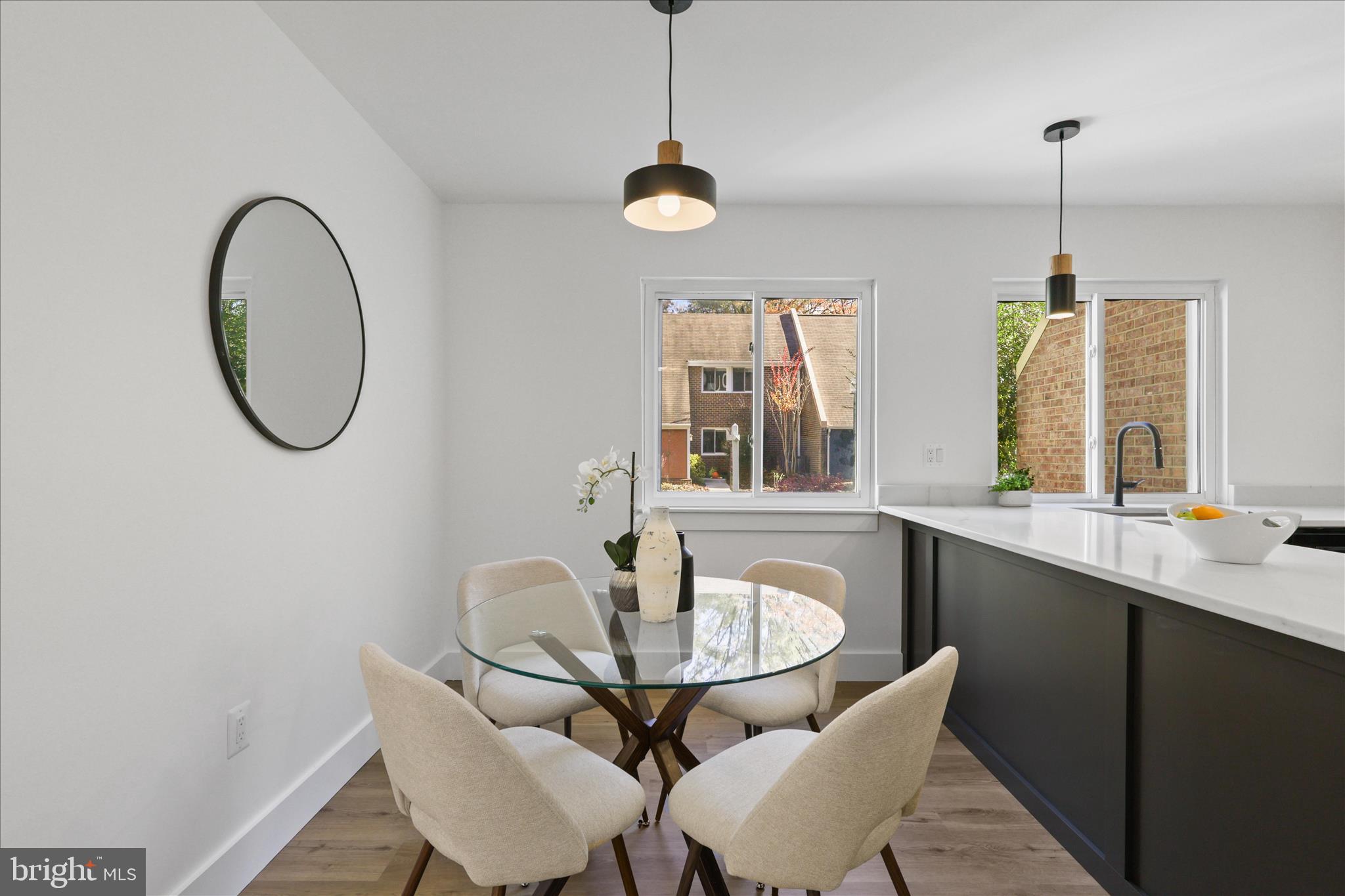 11152 Forest Edge Drive Reston, VA 20190 - Photo 9 of 57 a dining room with furniture and window