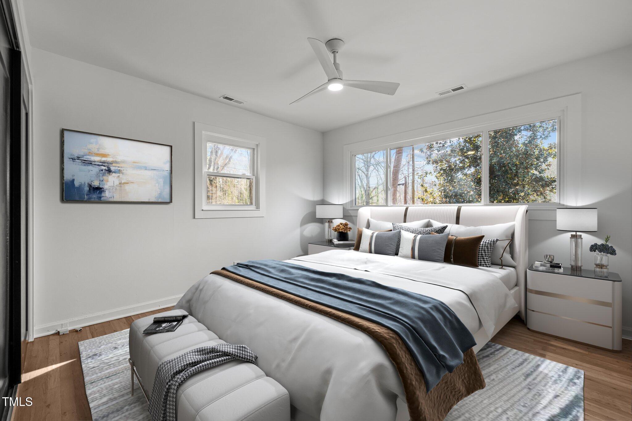 1805 Pritchard Place Durham, NC 27707 - Photo 24 of 46 a bedroom with a bed and a large window