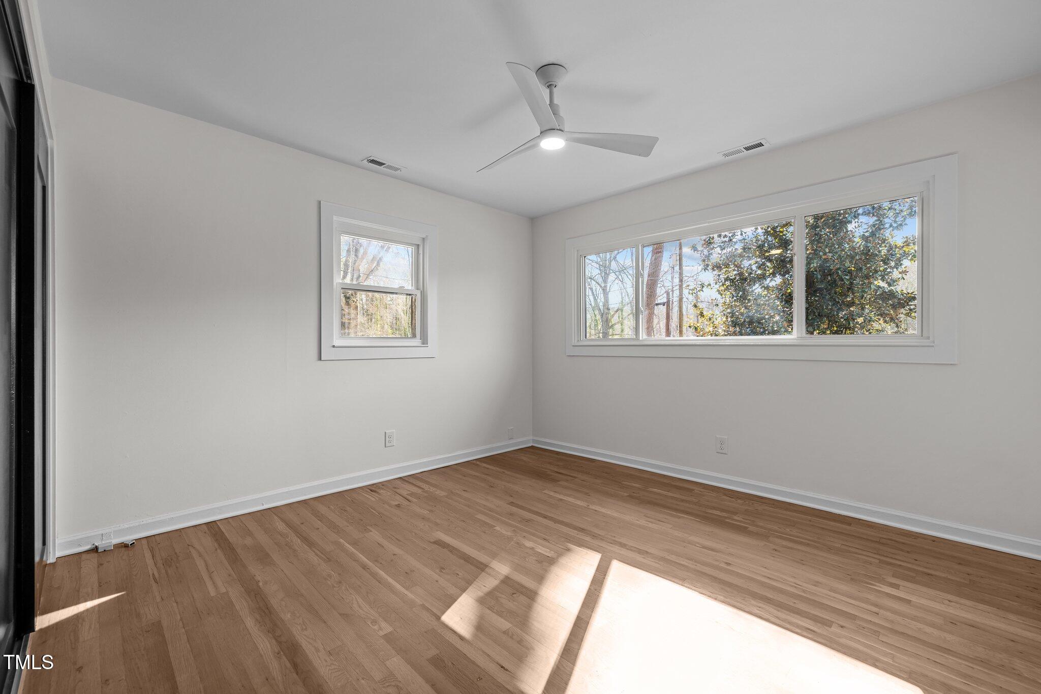 1805 Pritchard Place Durham, NC 27707 - Photo 25 of 46 wooden floor in an empty room with a window