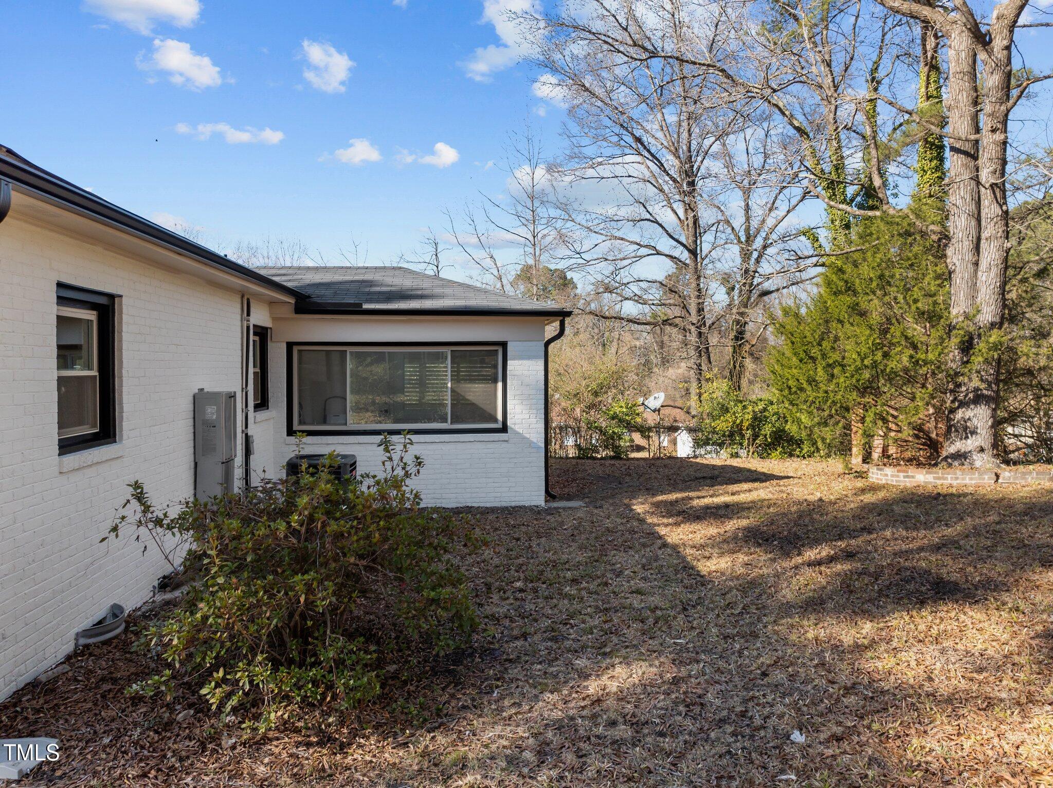 1805 Pritchard Place Durham, NC 27707 - Photo 39 of 46 a front view of a house with a yard