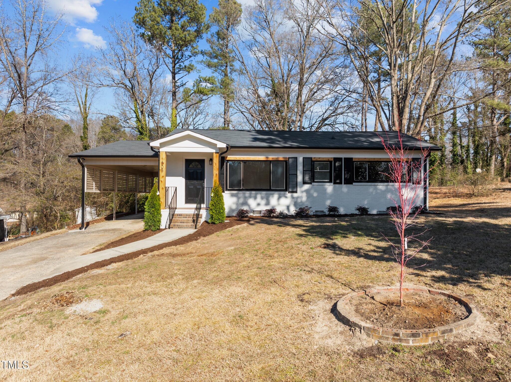 1805 Pritchard Place Durham, NC 27707 - Photo 3 of 46 a front view of a house with yard and tree s