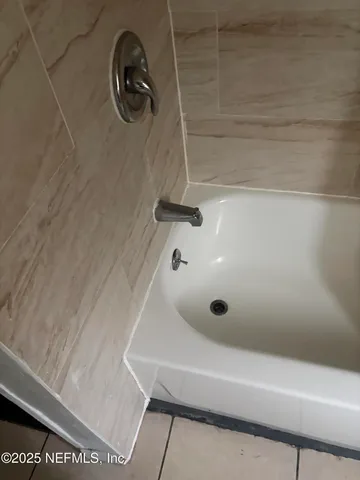 a bathroom with a bath tub