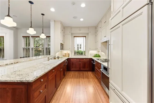 a large kitchen with kitchen island granite countertop a large counter top and sink