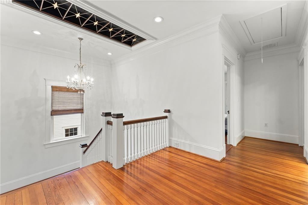 121 17th Street Northeast Atlanta, GA 30309 - Photo 24 of 53 a view of a hallway with wooden floor and staircase