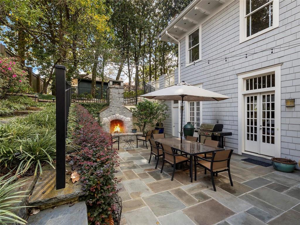 121 17th Street Northeast Atlanta, GA 30309 - Photo 38 of 53 a backyard of a house with table and chairs