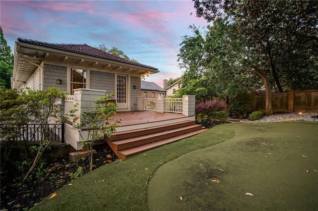 a view of backyard with green space