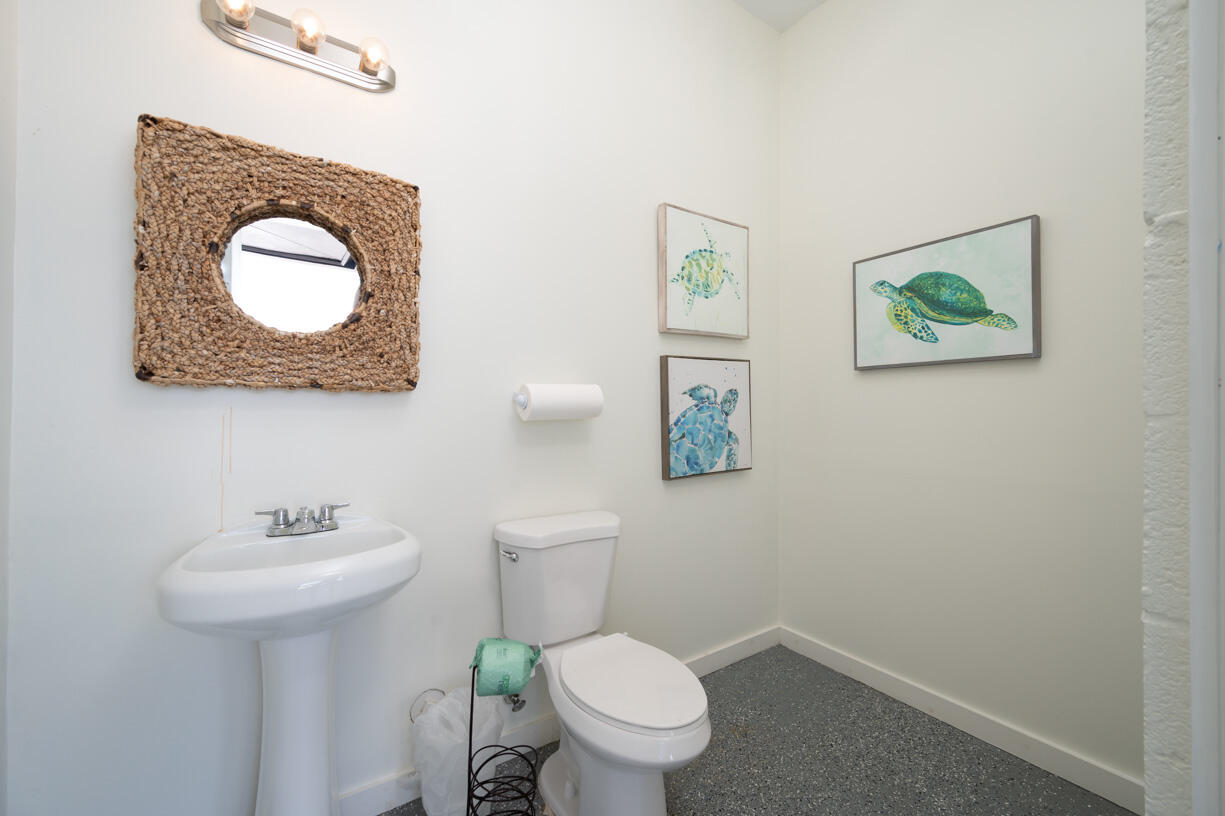 14 East Ocean Drive Marathon, FL 33050 - Photo 24 of 48 a bathroom with a toilet a sink and mirror
