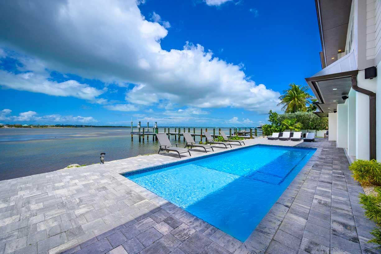 14 East Ocean Drive Marathon, FL 33050 - Photo 26 of 48 a view of a swimming pool with an outdoor seating