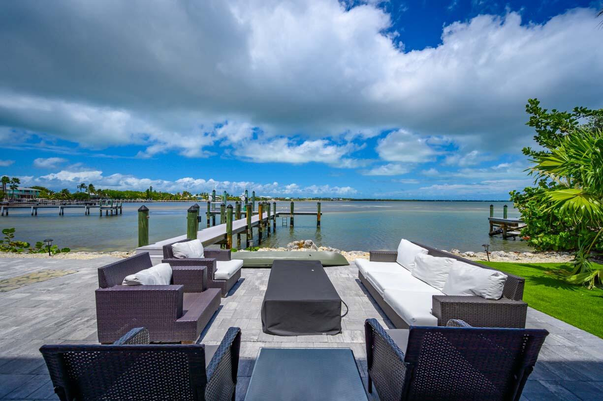 14 East Ocean Drive Marathon, FL 33050 - Photo 27 of 48 an outdoor sitting area with furniture and city view