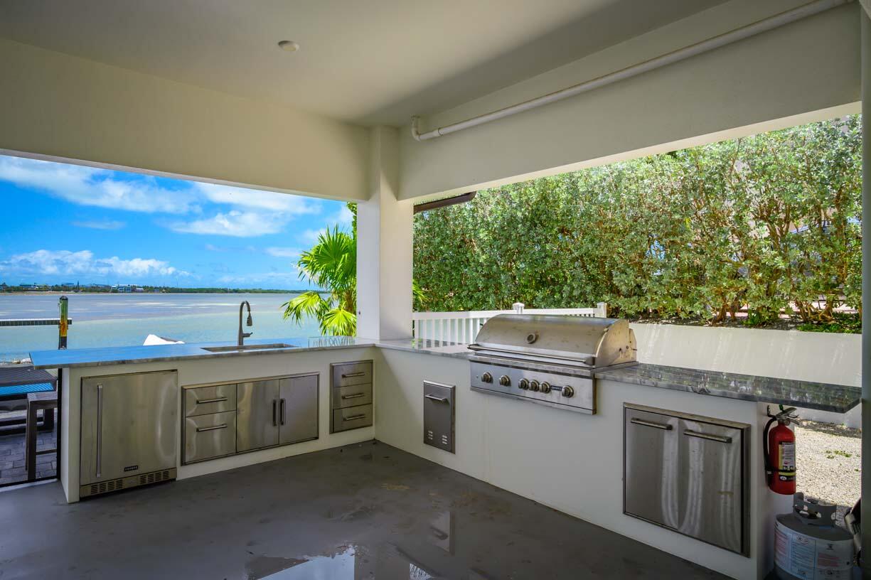 14 East Ocean Drive Marathon, FL 33050 - Photo 32 of 48 view of kitchen with stove and cabinets