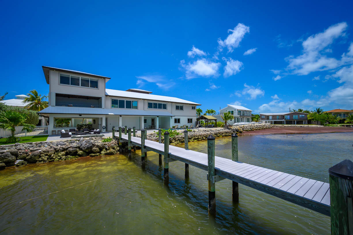 14 East Ocean Drive Marathon, FL 33050 - Photo 37 of 48 a view of a lake with a house in the background
