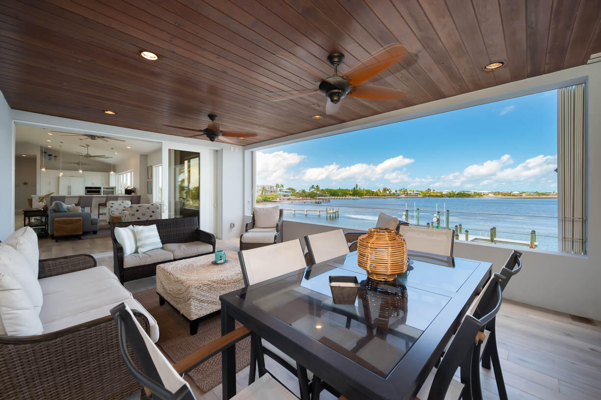 14 East Ocean Drive Marathon, FL 33050 - Photo 4 of 48 a living room with furniture and a floor to ceiling window