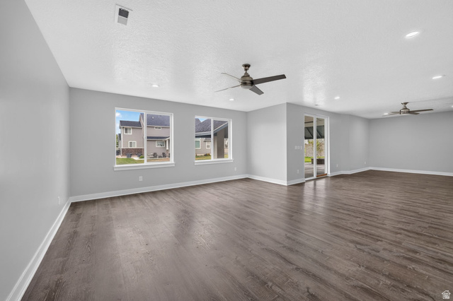 1002 West Temple Rim Lane Payson, UT 84651 - Photo 43 of 68 Spacious room featuring wood-finish flooring, light gray walls, and white baseboards