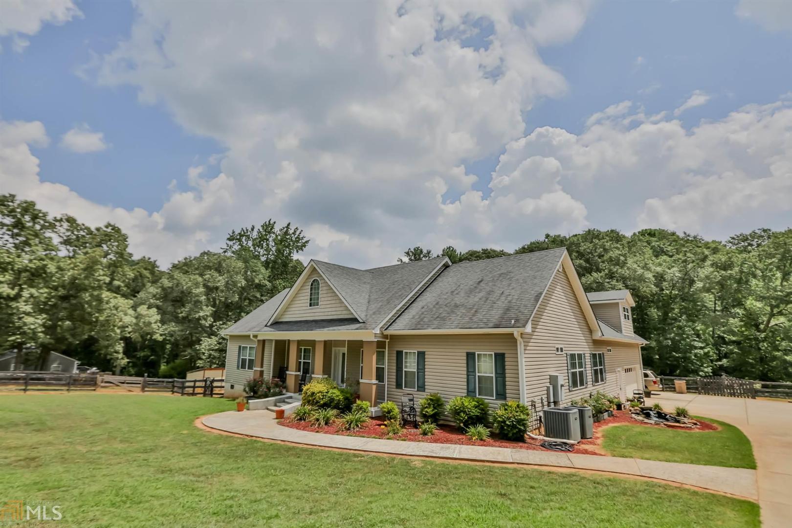 110 Redwood Valley Road Stockbridge, GA 30281 - Photo 1 of 1 a front view of a house with garden