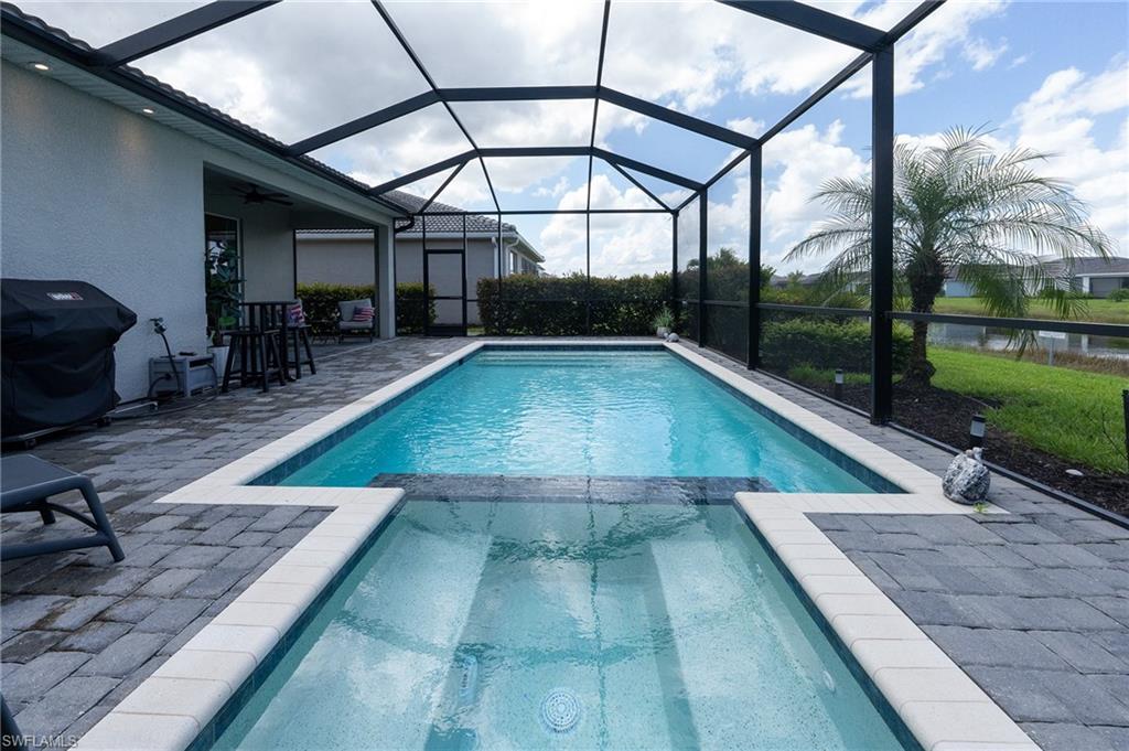 a view of a swimming pool with a patio