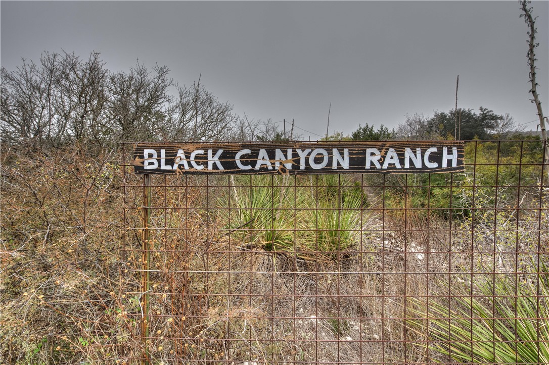 0 Leona Ranch Road Brackettville, TX 78832 - Photo 5 of 31 a street sign on a wall next to a road
