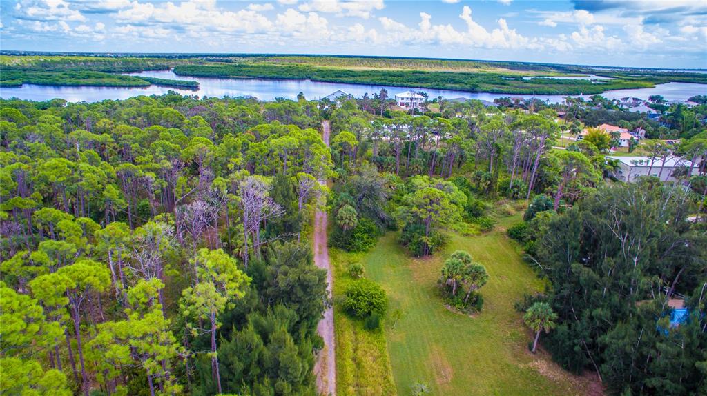 Deer Court Venice, FL 34293 - Photo 13 of 18 a view of a lake with a building in the back yard
