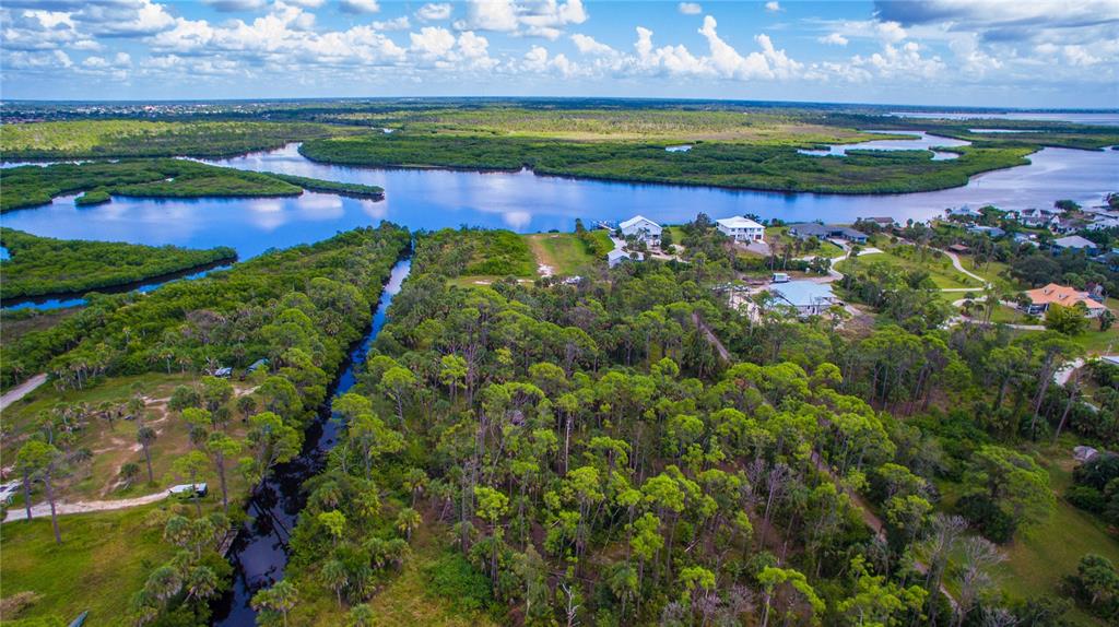 Deer Court Venice, FL 34293 - Photo 15 of 18 a view of a lake with a yard