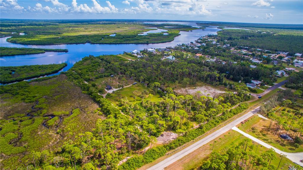Deer Court Venice, FL 34293 - Photo 16 of 18 a view of a lake with a building in the background
