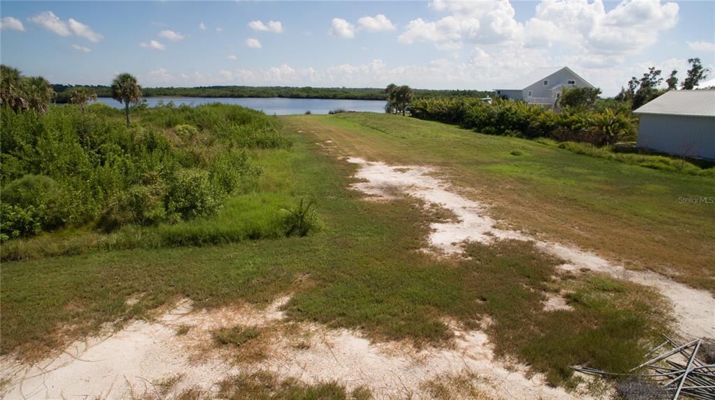 Deer Court Venice, FL 34293 - Photo 5 of 18 a view of a lake with a yard