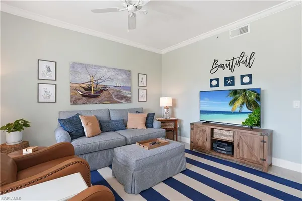 a living room with furniture or couch and a flat screen tv