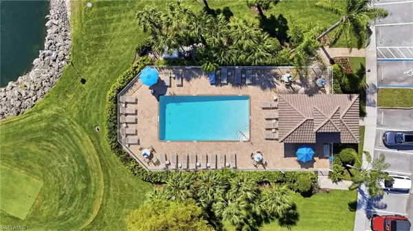 an aerial view of residential houses with outdoor space and street view