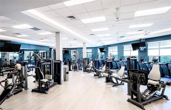 a view of a terrace with furniture and a garden