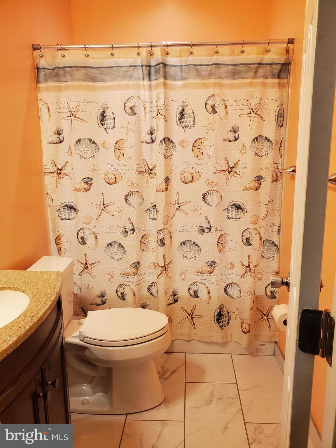 7520 Broomes Island Road St. Leonard, MD 20685 - Photo 30 of 35 Lower level full bath tub/shower ceramic tile