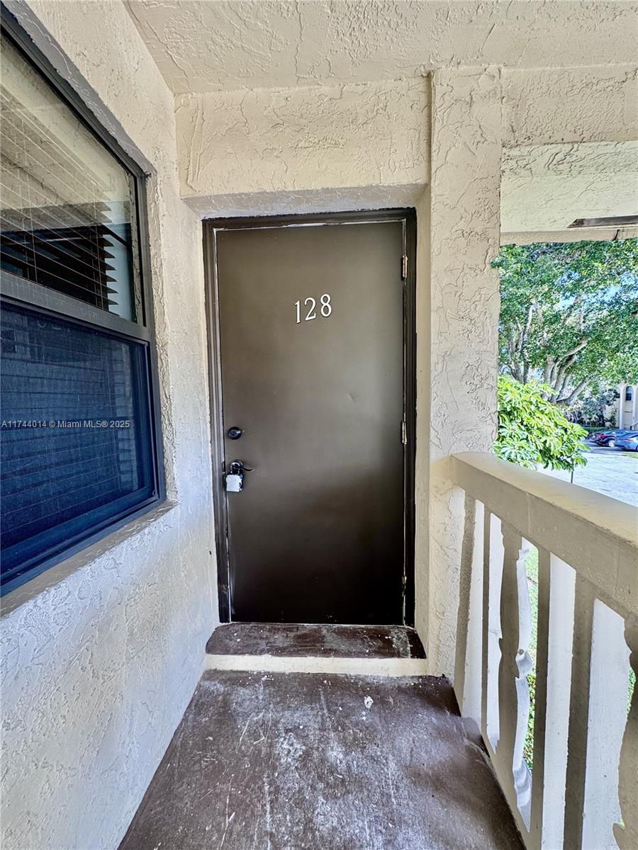 140 South Cypress Road, Unit 128 Pompano Beach, FL 33060 - Photo 11 of 13 a view of an entrance of the house