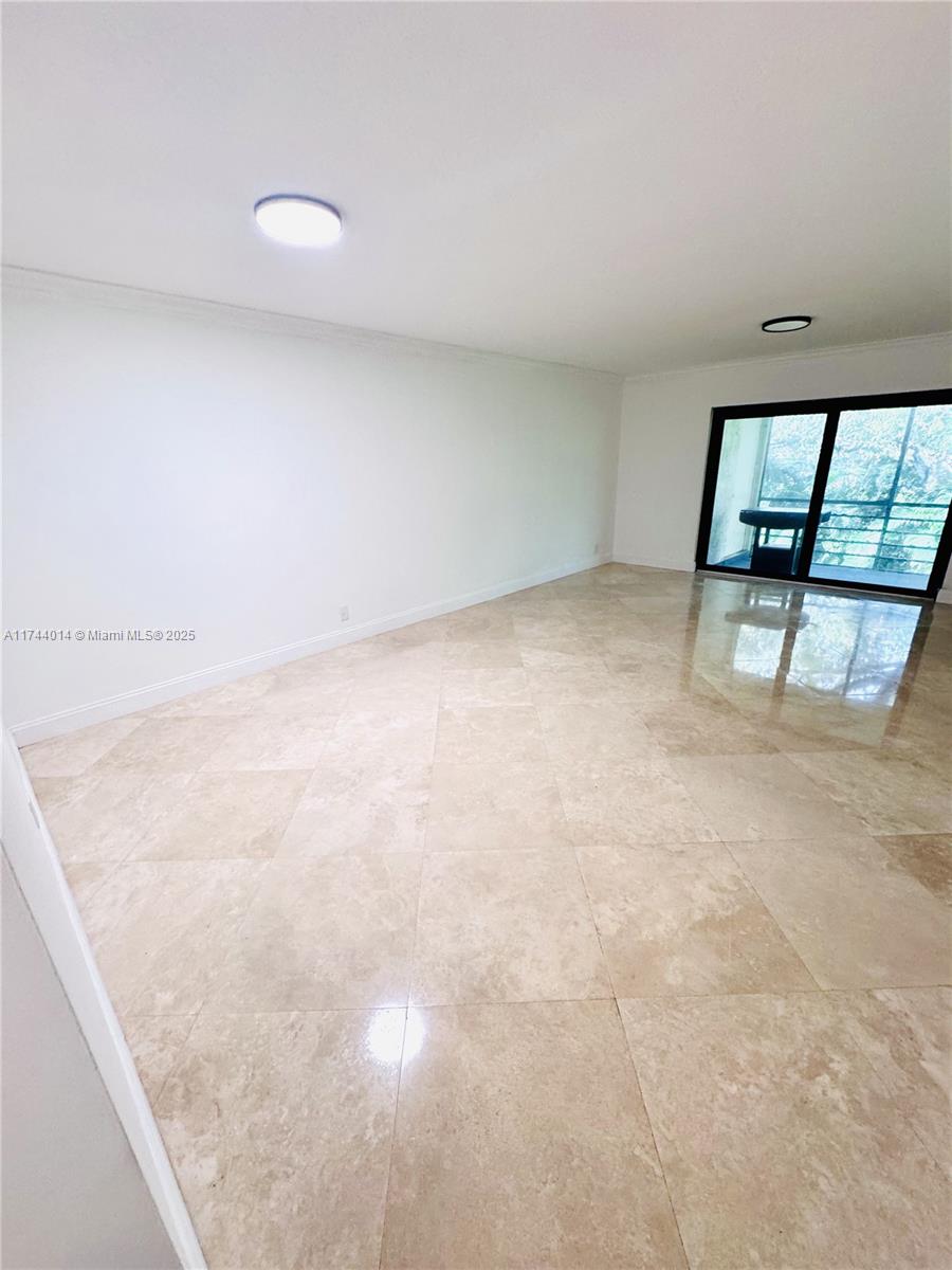140 South Cypress Road, Unit 128 Pompano Beach, FL 33060 - Photo 4 of 13 a view of an empty room