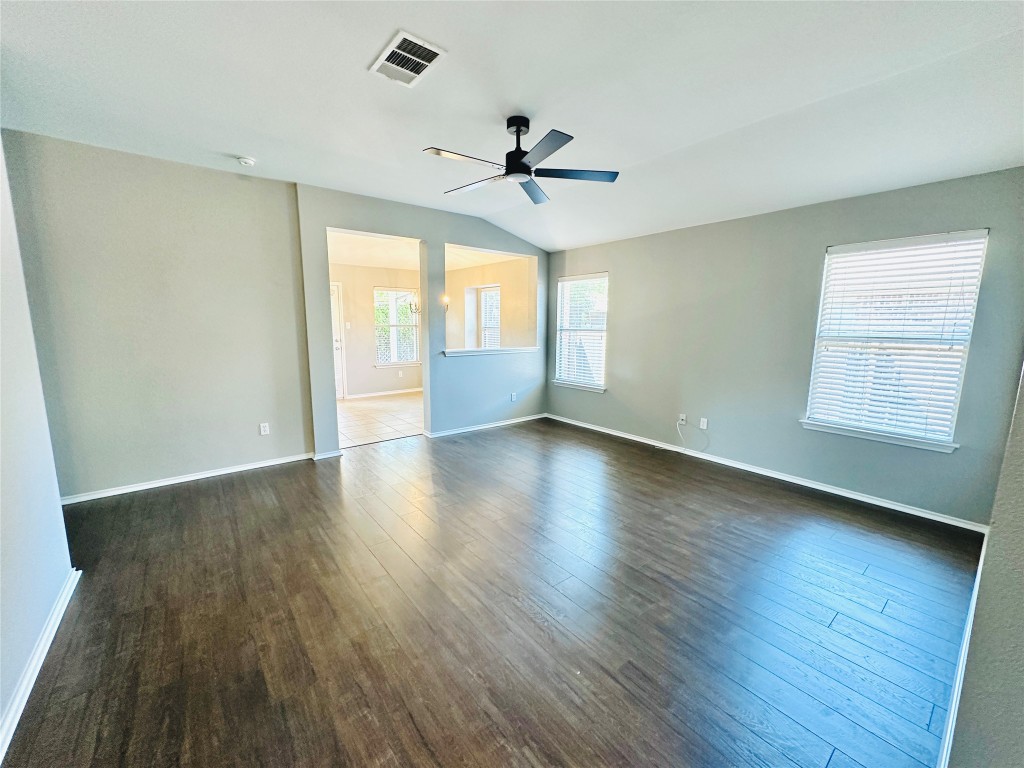 12112 Rancho Alto Road Austin, TX 78748 - Photo 14 of 34 wooden floor in an empty room with a window