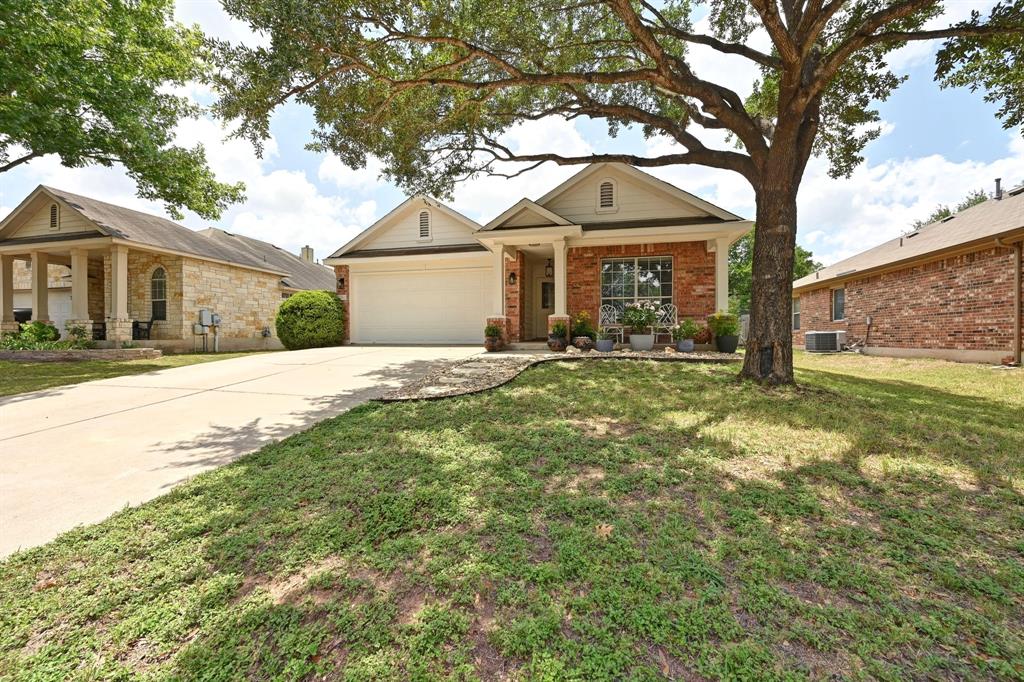 12112 Rancho Alto Road Austin, TX 78748 - Photo 2 of 34 a front view of a house with a yard