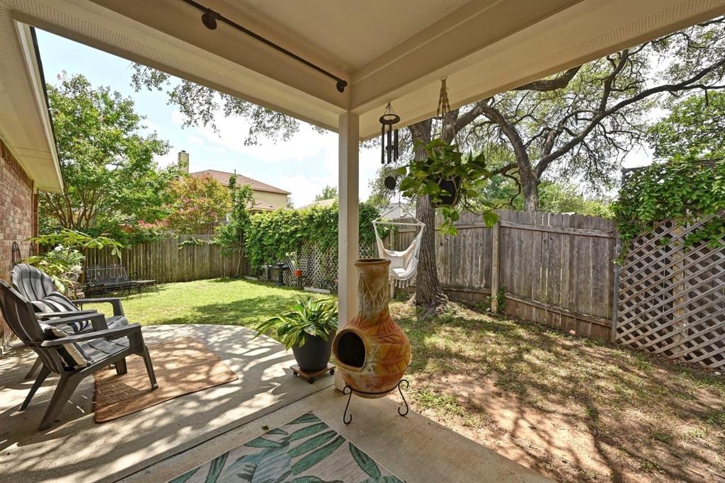 12112 Rancho Alto Road Austin, TX 78748 - Photo 33 of 34 a view of a porch with chairs and backyard
