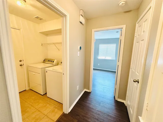 a view of a bathroom with wooden floor