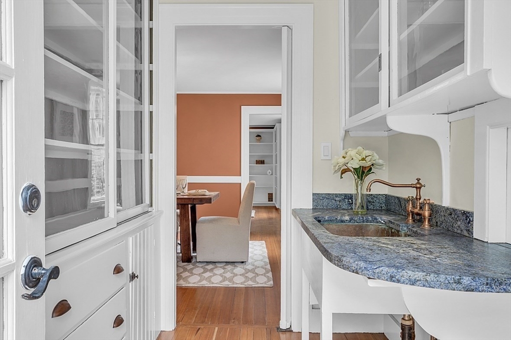 24 Sandy Pond Road Lincoln, MA 01773 - Photo 14 of 42 a bathroom with a granite countertop sink and a mirror
