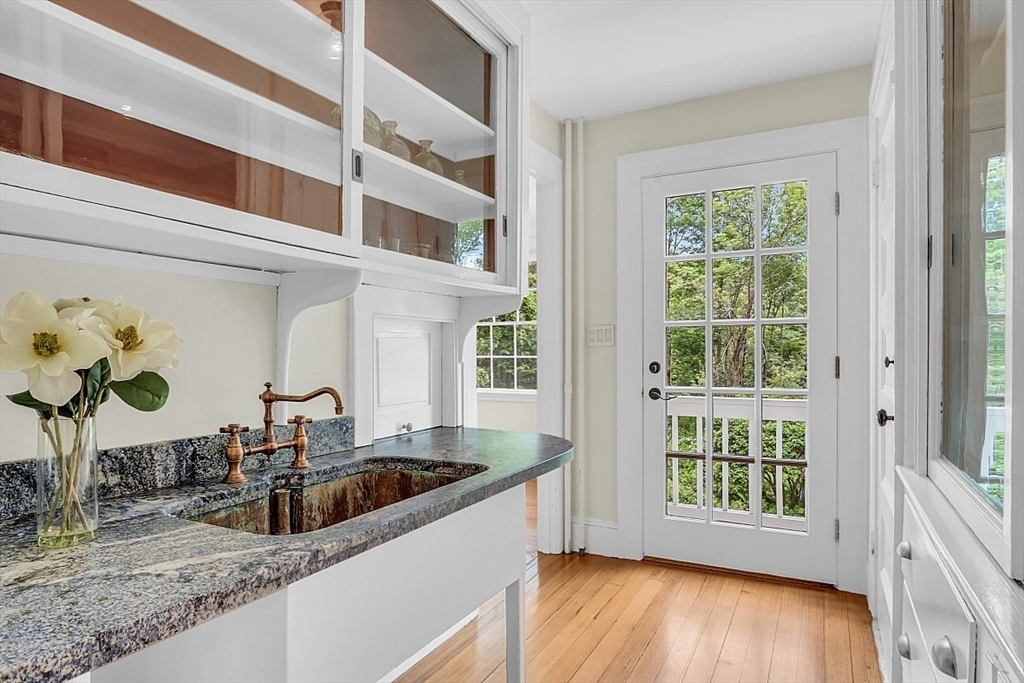 24 Sandy Pond Road Lincoln, MA 01773 - Photo 15 of 42 a kitchen with a sink and a large window