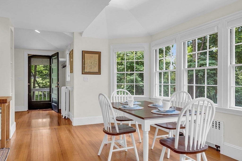 24 Sandy Pond Road Lincoln, MA 01773 - Photo 20 of 42 a view of a dining room with furniture window and outside view